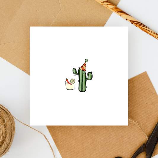 Card with a cactus wearing a party hat and holding a drink on a brown paper background